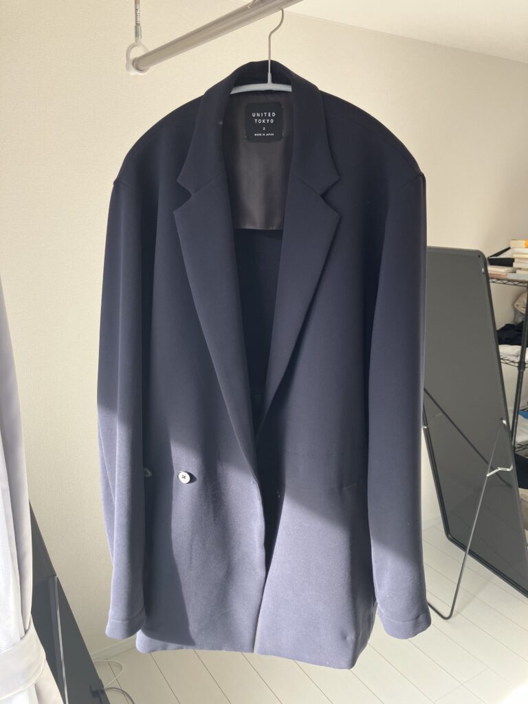 UNITED TOKYOのダブルクロスアシメジャケットのネイビー